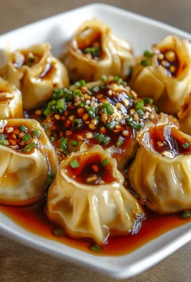 Chicken Wontons in Spicy Chili Sauce